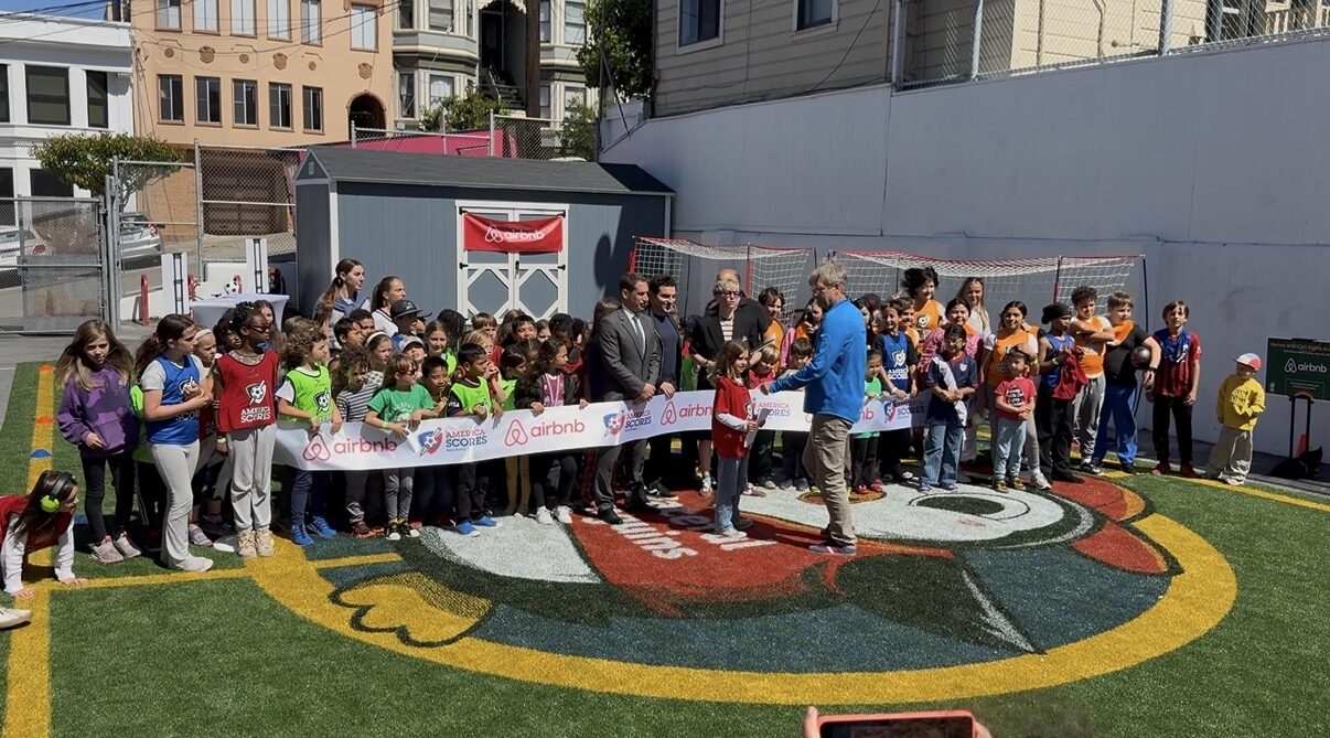 Mayor of San Francisco and Airbnb co-founder with students at a Pivot field unveiling