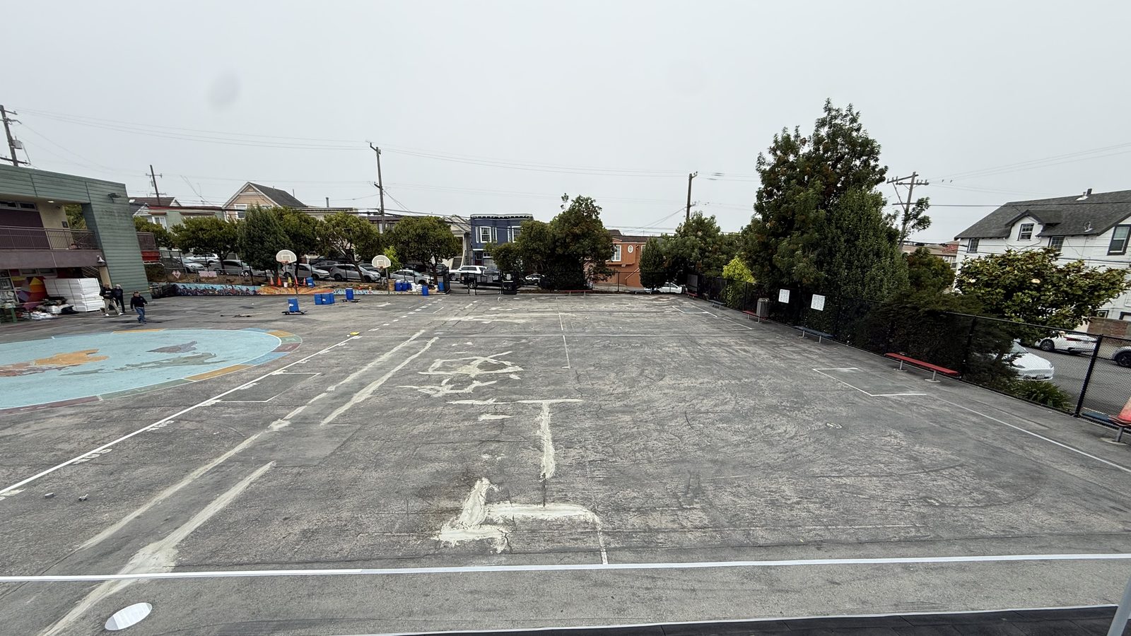 Monroe Elementary before: cracked, patched asphalt blacktop